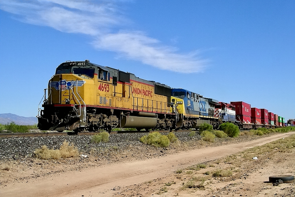 UP 4693, CSX 519, HLCX 6208 is a class SD70 and  is pictured in Tucson, AZ, USA.  This was taken along the Tucson Lordsburg District on the Union Pacific Railroad. Photo Copyright: Rick Doughty uploaded to Railroad Gallery on 11/28/2023. This photograph of UP 4693, CSX 519, HLCX 6208 was taken on Tuesday, October 05, 2004. All Rights Reserved. 